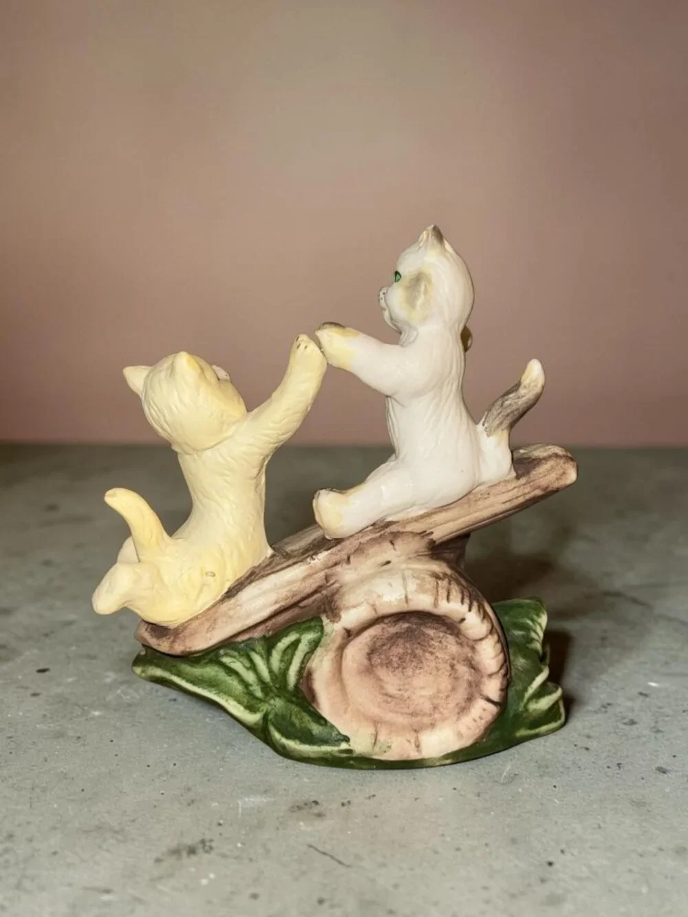 Vintage Ceramic Figurine Of Two Playful Cats On Log With Green Leaves